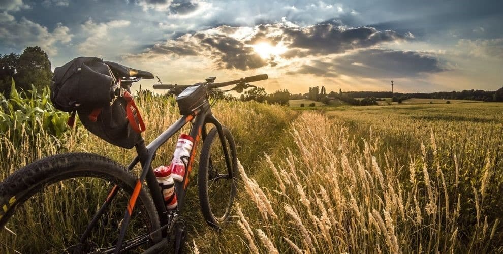 Bike on grass looking at hills in distance