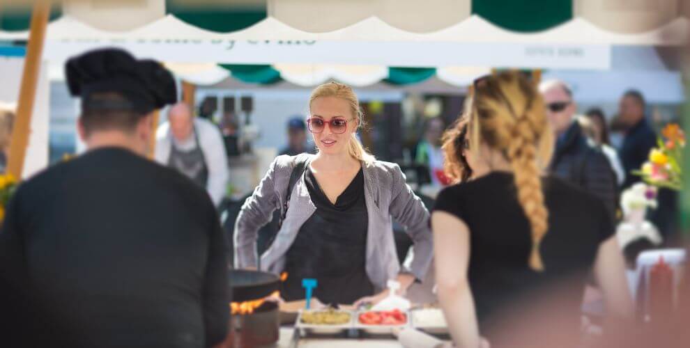 woman waiting for food at a food tent